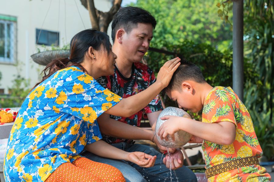 Thai family celebrate Songkran traditions