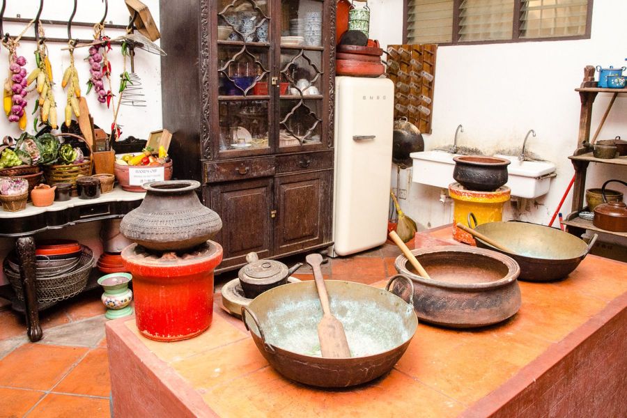Traditional Peranakan kitchen with vintage cookware and utensils