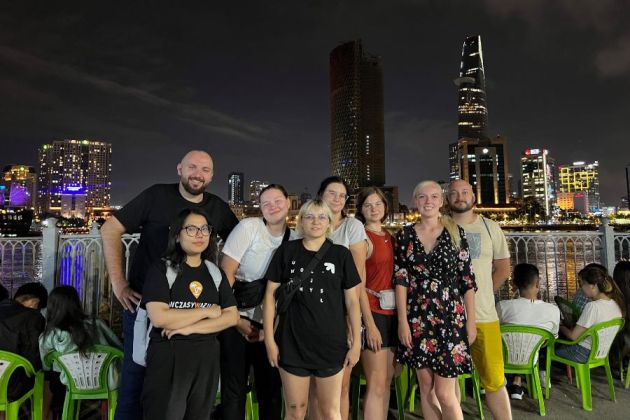 Group photo with Saigon night view