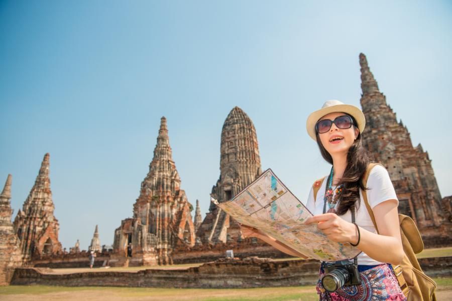 Traveler exploring Southeast Asia with a map